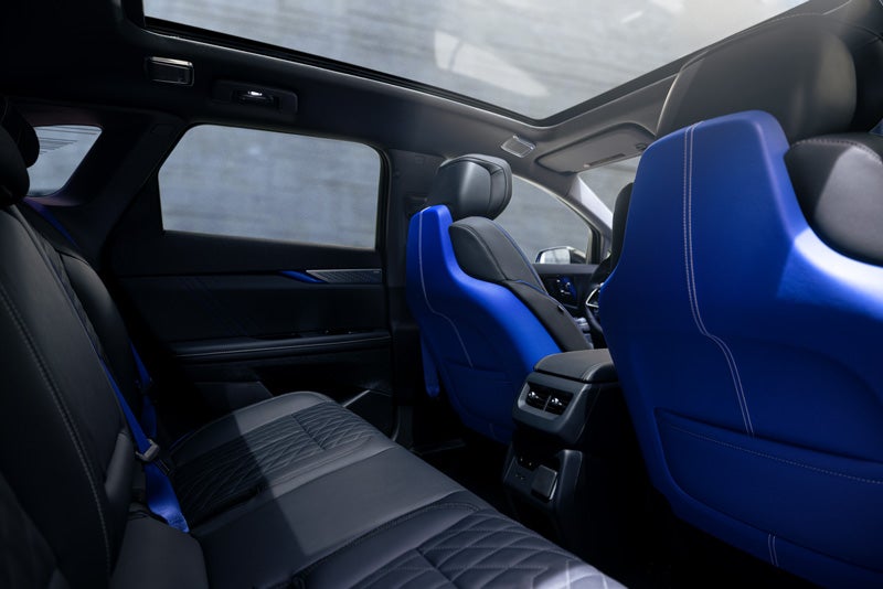 Back Seat View of the 2026 OPTIQ-V Blue Front Seats, Sun Roof, and Interior | Brogan Cadillac of Totowa in Totowa NJ